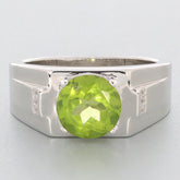 Round green peridot gemstone set in a sterling silver ring, showcasing elegant accents for a luxurious look.